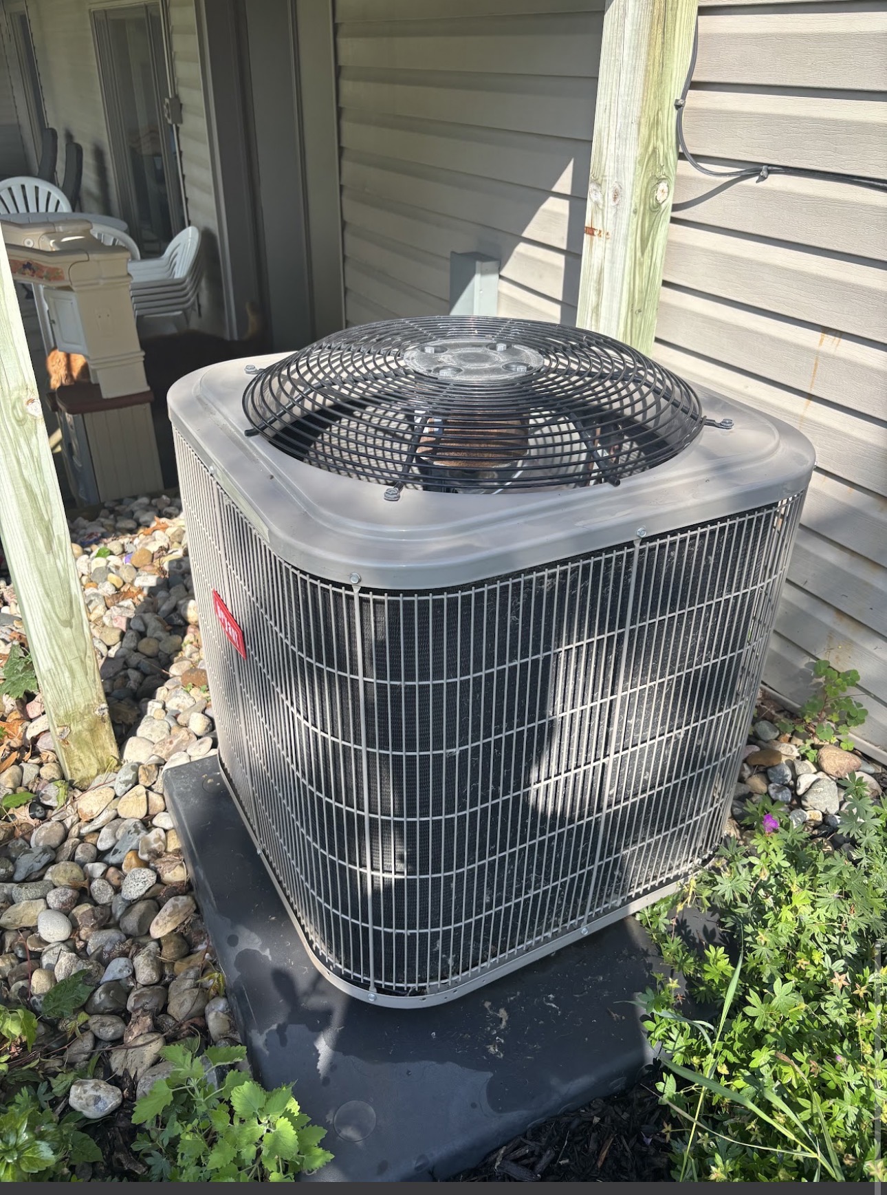 Bryant residential air conditioning condenser on a new pad